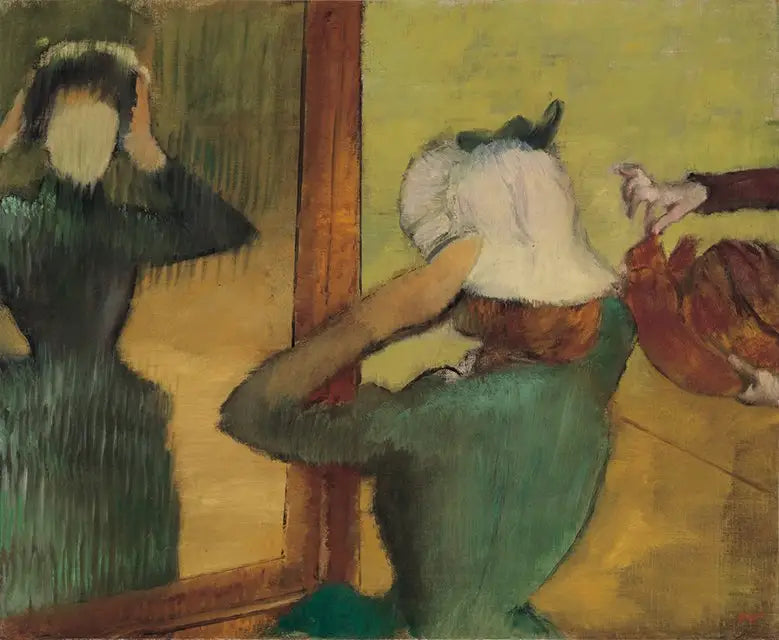 En la modista - Edgar Degas