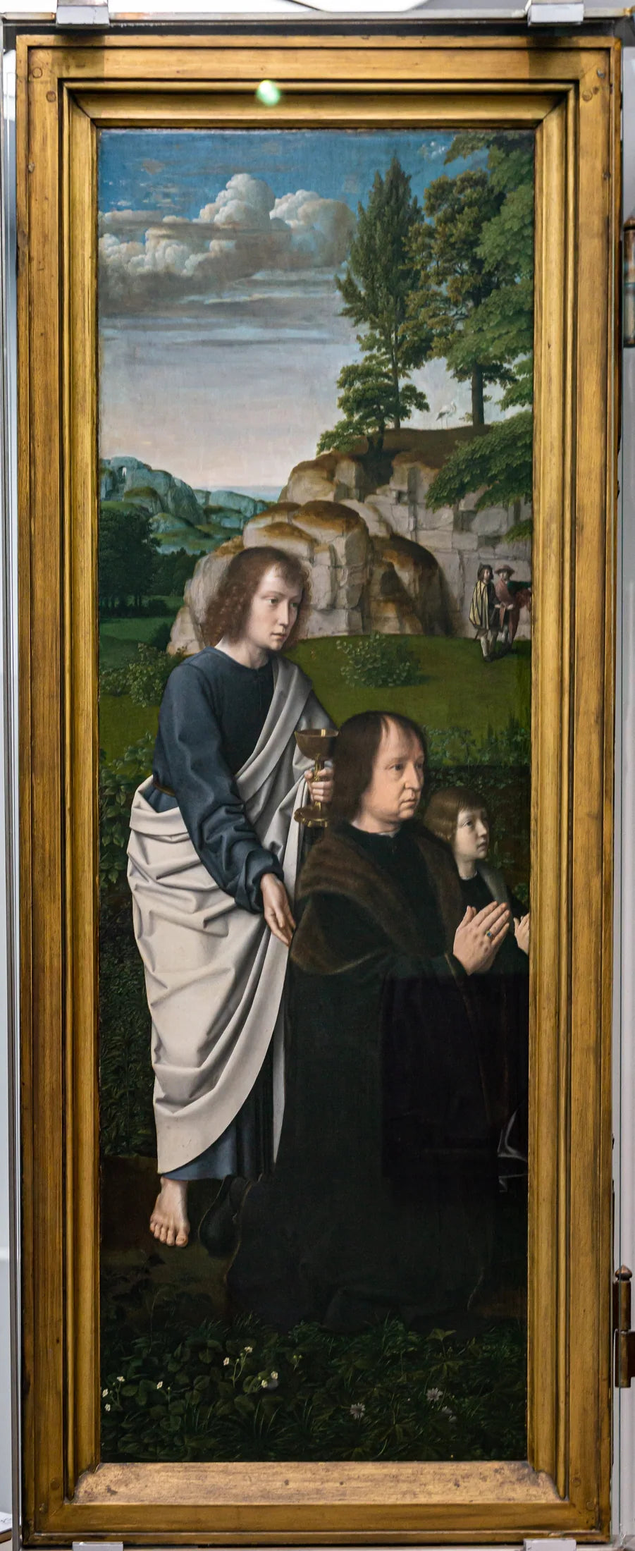 De H. Johannes de Evangelist met Jan de Trompes en zijn zoon - Gérard David image 1 tableau peint à l’huile sur toile