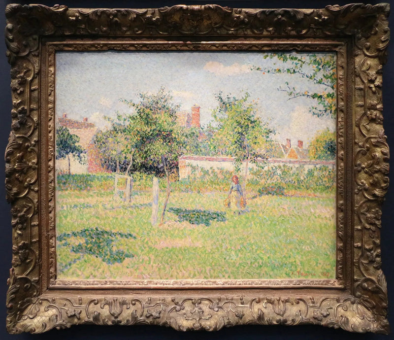 Mujer en un jardín, sol de primavera en el prado de Éragny - Camille Pissarro