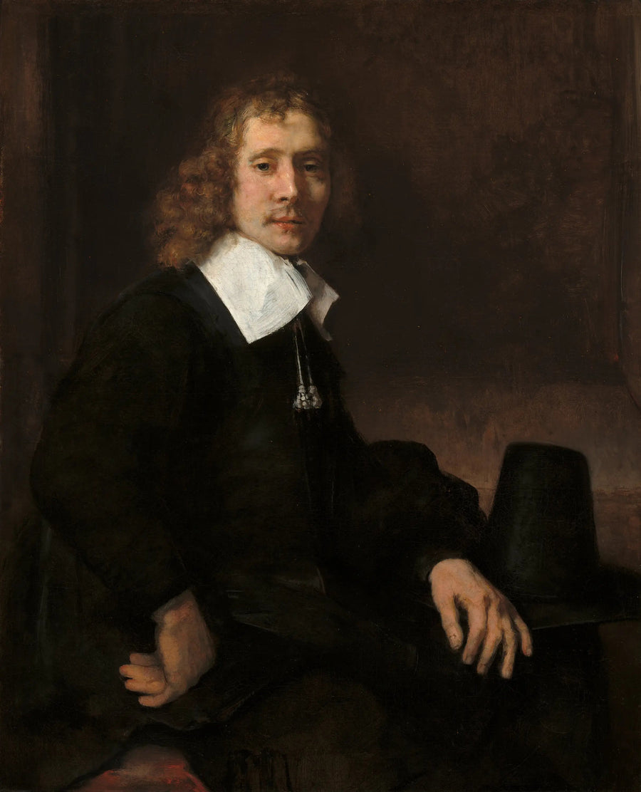 Un joven sentado a una mesa (quizás Govaert Flinck) - Rembrandt