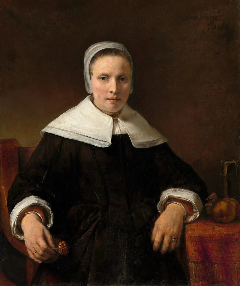 Una mujer sosteniendo una rosa - Rembrandt