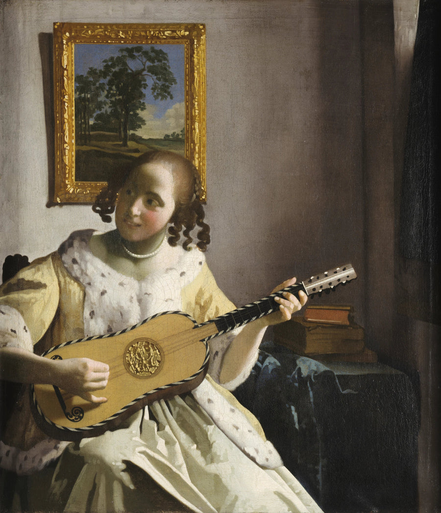 Una mujer tocando la guitarra - Johannes Vermeer